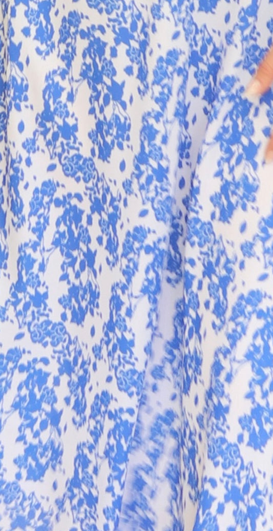 white fabric blue flowers